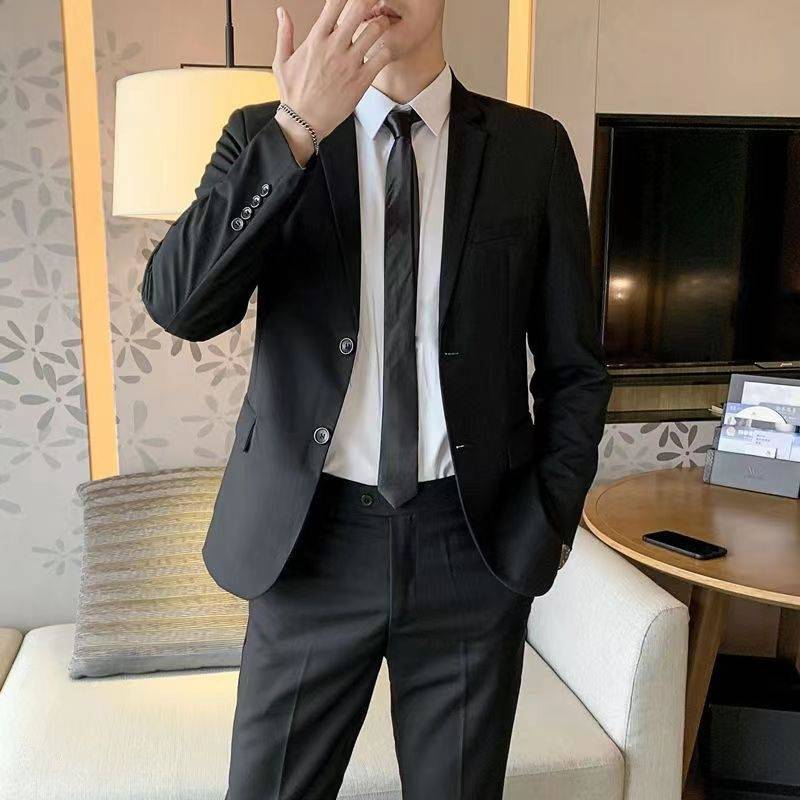 Two-button black suit + white shirt + black suit + tie